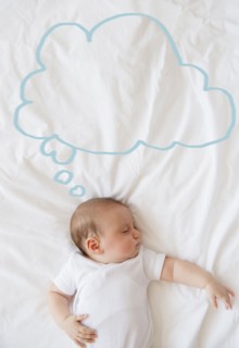Baby girl (2-5 months) sleeping in bed.
Photo : Jamie Grill