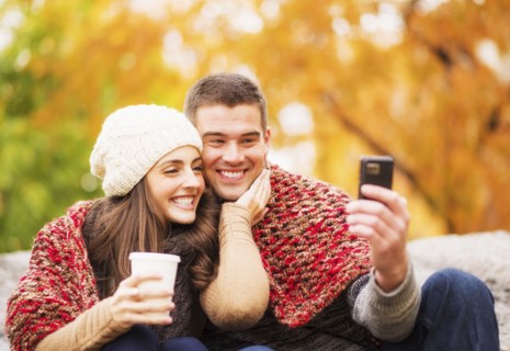 Portrait of couple in Central Park taking photo of themselves. USA, New York State, New York City