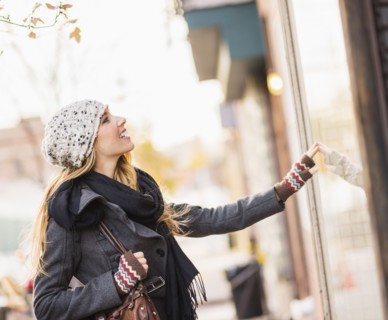 Portrait of blond woman looking at window display. USA, New York City, Brooklyn, Williamsburg