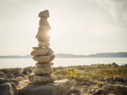 Stack of stones by lake. USA, Utah, Bear Lake.
