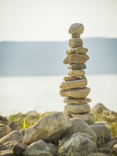 Stack of stones by lake. USA, Utah, Bear Lake.