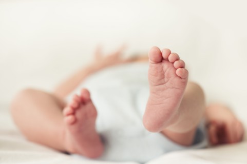 View of newborn baby (0-1 months) feet.