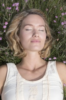 Woman relaxing on meadow.
Photo : Jan Scherders