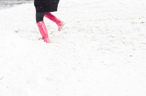 Low section of person dancing in snow. New York City, USA.