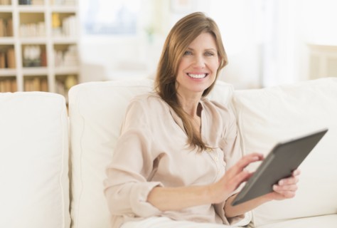 Portrait of woman using tablet pc.