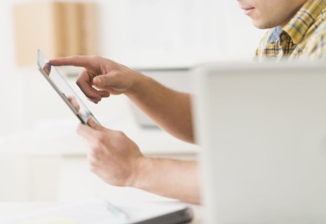 Young man using tablet.