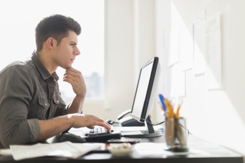 Young man using computer.