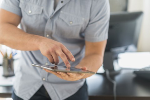 Young man using tablet.