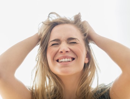 Frustrated woman pulling hair.
