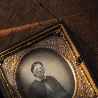 Studio shot of old fashioned photograph in picture frame.