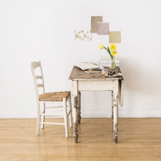Old desk and chair in room.