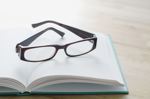 Studio shot of spectacles on book.
Photo : Kristin Lee