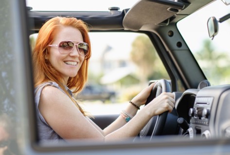 Portrait of woman sitting in car.