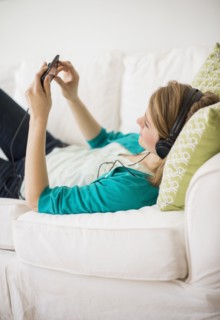 Woman watching movie on smart phone.
