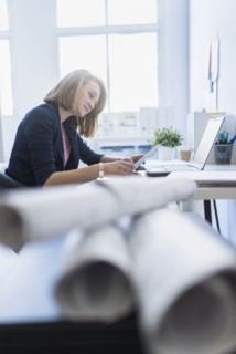 Side view of business woman in office.