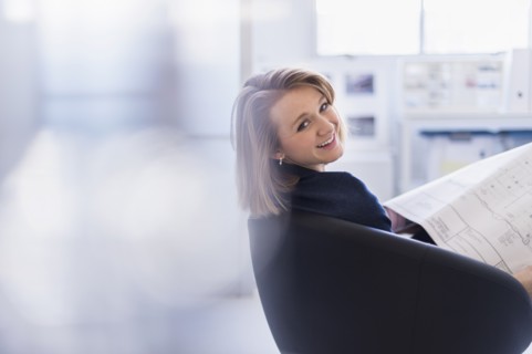 Portrait of smiling business woman in office.
