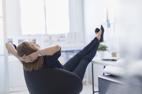 Business woman relaxing in office.