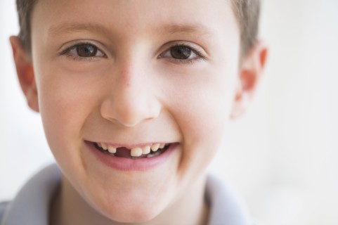 Portrait of boy (8-9) smiling.
