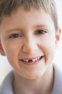 Portrait of boy (8-9) smiling.