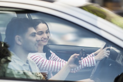 Young couple traveling in car.