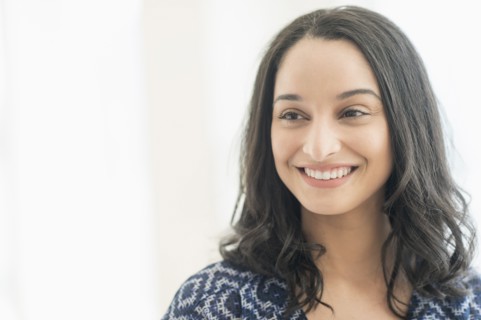 Portrait of smiling young woman .