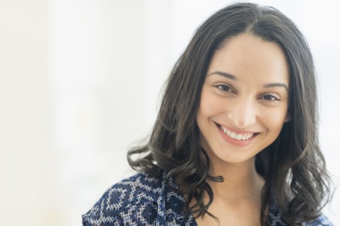 Portrait of smiling young woman .
