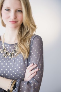 Portrait of attractive blond woman with arms crossed.
Photo : Jamie Grill