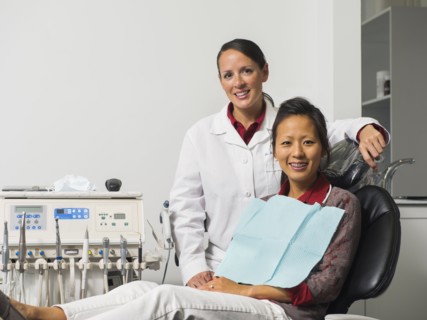 Portrait of dentist with patient.