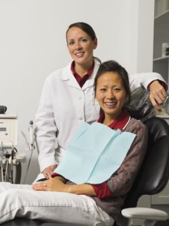 Portrait of dentist with patient.