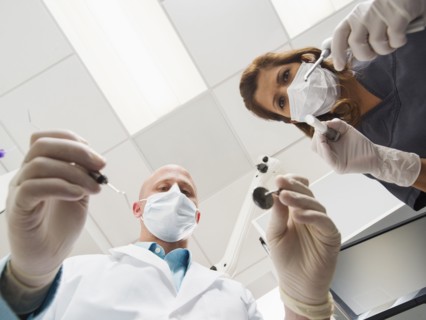 Lowe angle view of dentist and assistant.