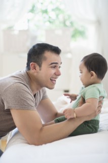 Father playing with his son (6-11 months).