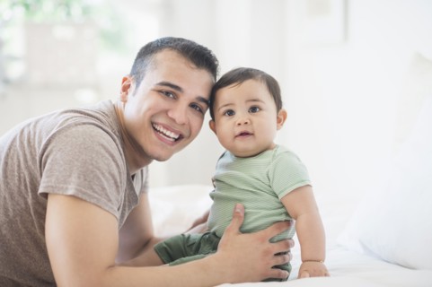 Father holding his son (6-11 months).