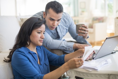Couple working in living room.