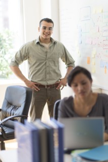 Two people working in office.