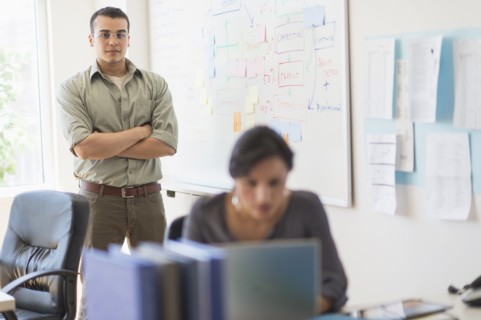 Two people working in office.