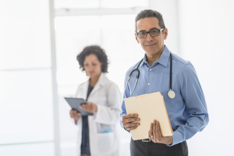 Female and male doctors in hospital.