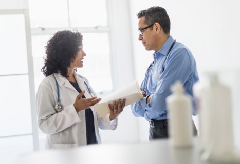 Female and male doctors working together.