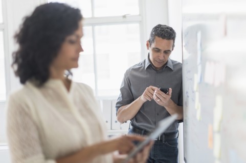 Man and woman working in office.