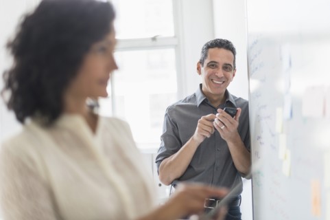 Man and woman working in office.