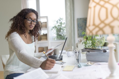 Woman using laptop at home.