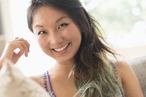 Portrait of young woman smiling.