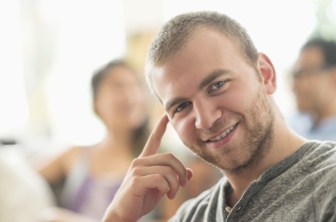 Portrait of young man smiling.