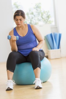Woman exercising at gym.