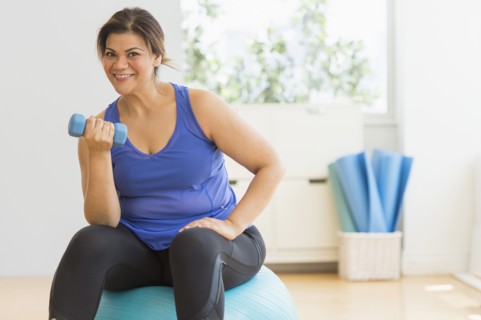 Woman exercising at gym.