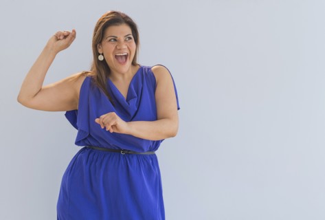 Studio shot of happy woman.