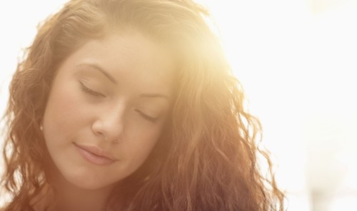 Portrait of woman in sunlight.