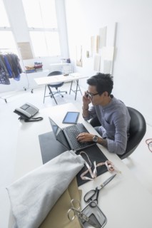 Fashion designer working in studio.