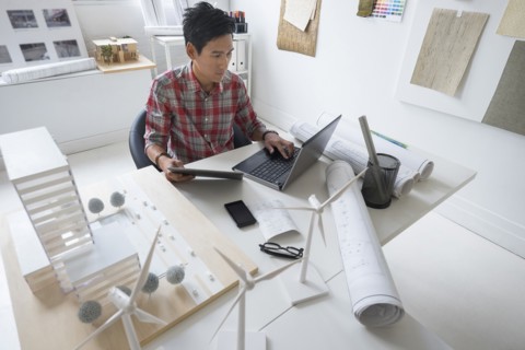Architect working in office.