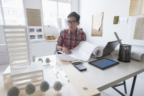 Architect working in office.
