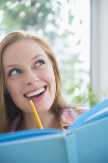 Portrait of young woman planning